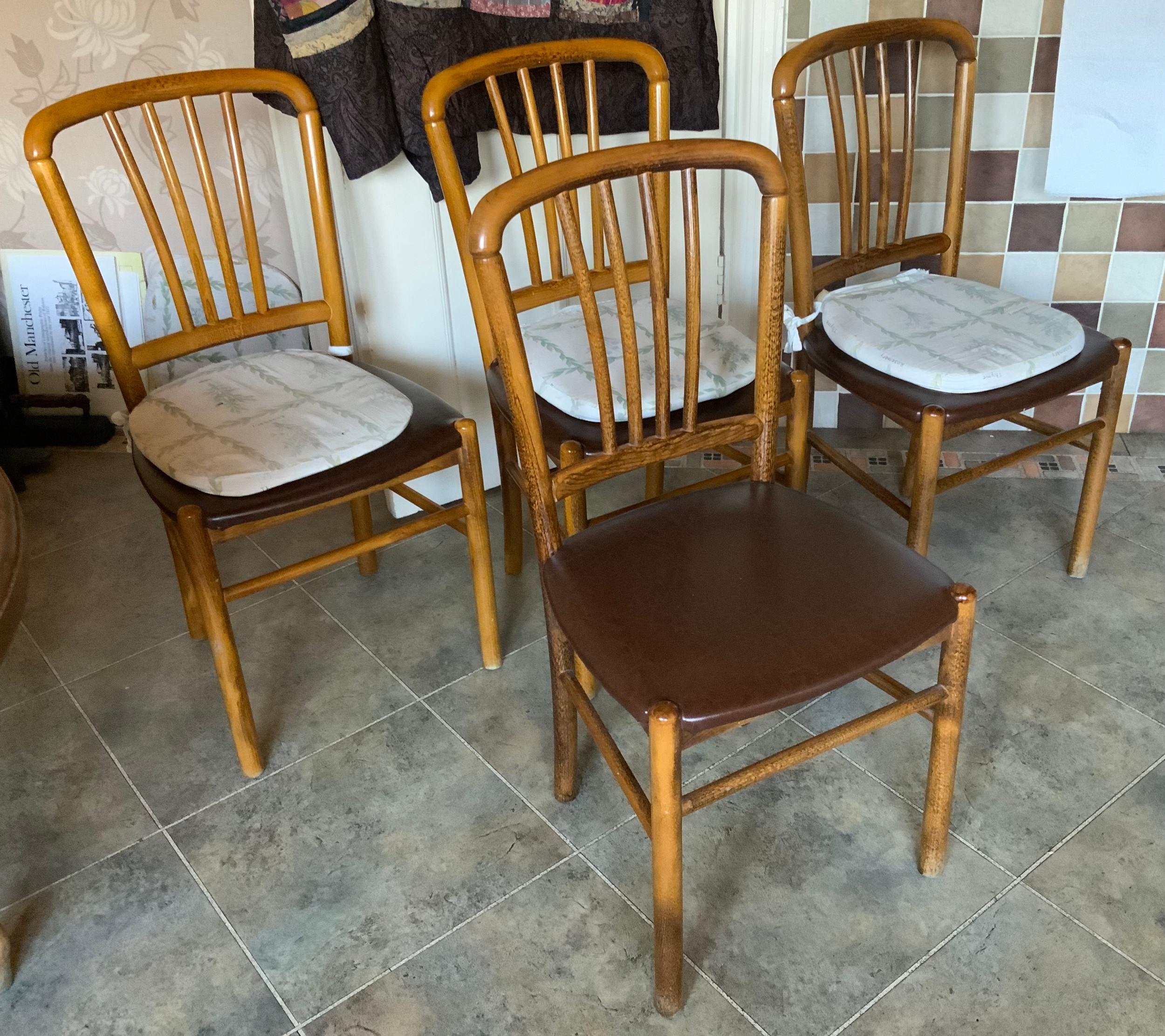 A set of four arched back beech kitchen chair, leatherette seats ** We would please ask that all