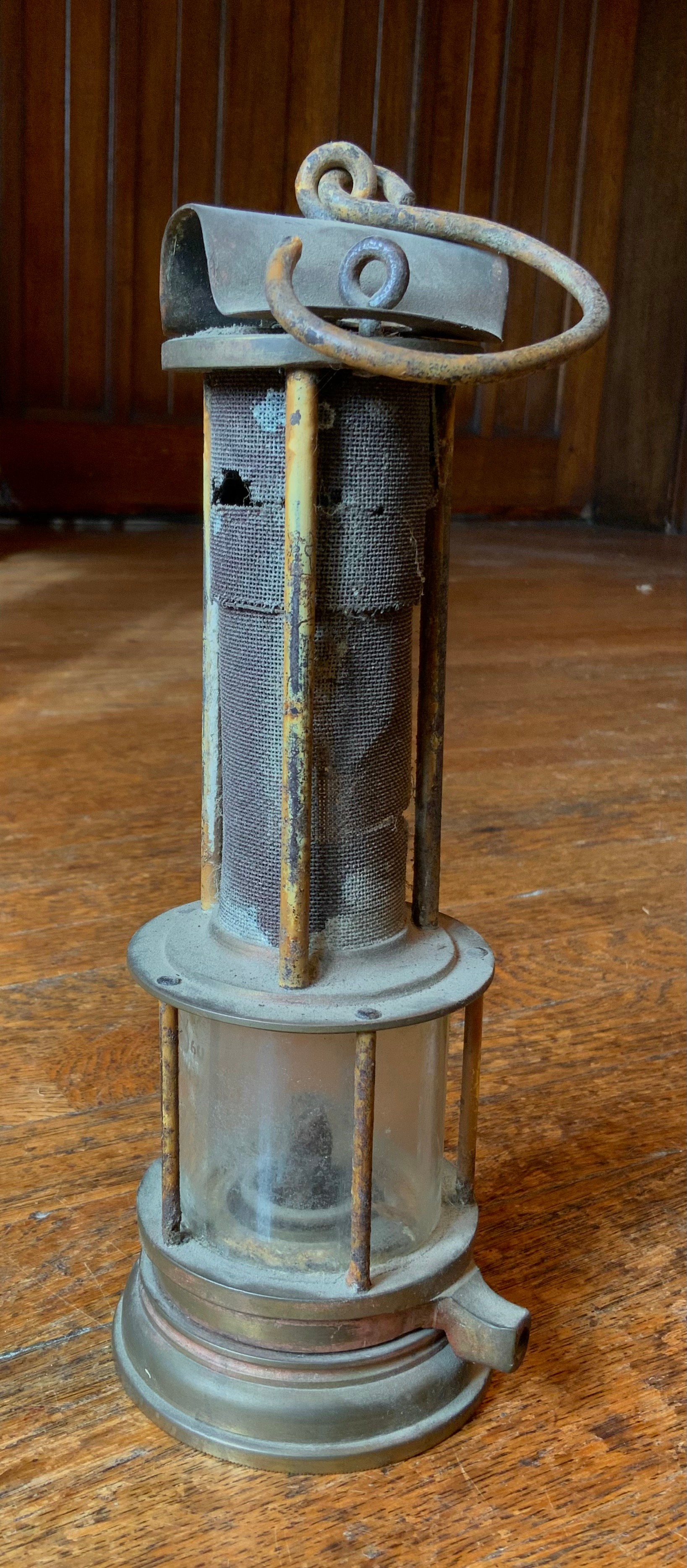 A Joseph Cooke Clanny type miners lamp, glass protected by five rods, the gauze by three rods,