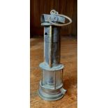 A Joseph Cooke Clanny type miners lamp, glass protected by five rods, the gauze by three rods,