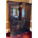 An early 20th century mahogany hall cupboard, the breakcentre cornice, astragal glazed door, above