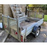 A two wheel flat bed trailer with fall down tail ramp, 250 x 150 load size. ** We would please ask