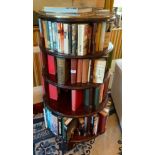 An early 20th century mahogany revolving four-tier circular bookcase, pierced gallery, with