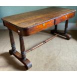 A William IV rosewood sofa table, rounded rectangular top, egg-and-dart border, the frieze with