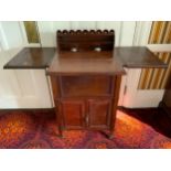 An unusual early 20th century mahogany lady's writing/dressing table, the folding rectangular top