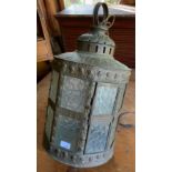 A late 19th/ early 20th century hall lantern, embossed with classical busts, bubbles frosted glass