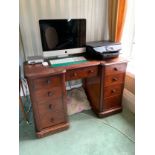 A Victorian mahogany breakfront desk, fitted with central drawer to kneehole, flanked by four