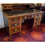 An Edwardian mahogany and satinwood strung writing desk, by Waring, the superstructure fitted with