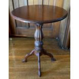 A 19th century mahogany occasional table, circular top, lobed baluster columns, four shaped legs,
