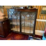 An early 20th century mahogany bow front double door display cabinet, ball and claw feet, 134cm