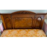 A Victorian walnut double bed headboard, slight arched back, carved with leafy scrolls, shaped