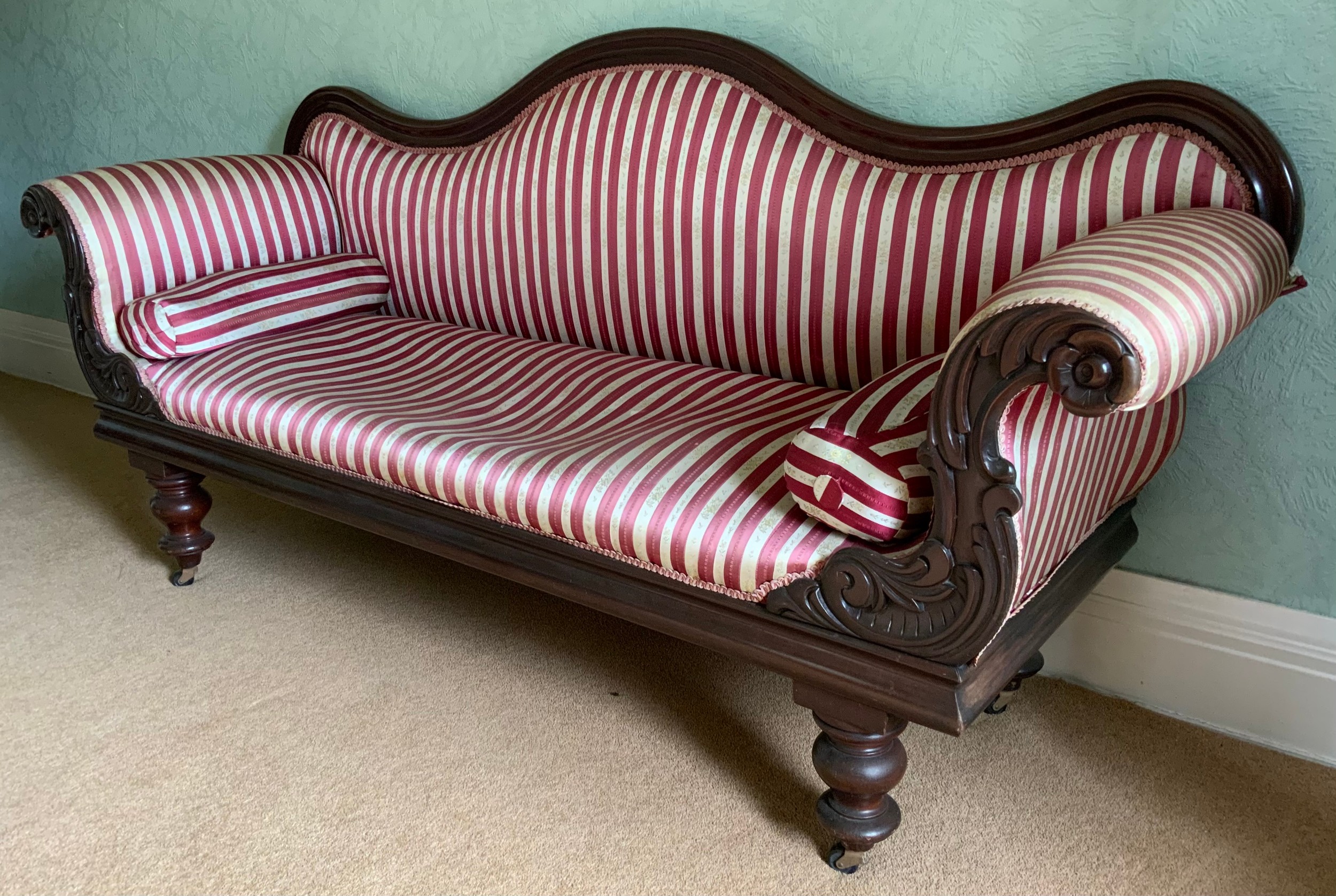 A Victorian mahogany sofa, leafy scroll arms, turned legs, red adn white striped upholstery, 208cm - Image 2 of 3