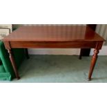 A mahogany rectangular side table, moulded rectangular top, turned cylindrical lags, 77cm high, 75cn
