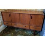 A G Plan teak sideboard, with two folding doors, long and two smaller drawers, one divided for