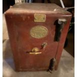 A Suitcliffe Binns & Sons safe, with key; a metal strong box, with key. ** We would please ask