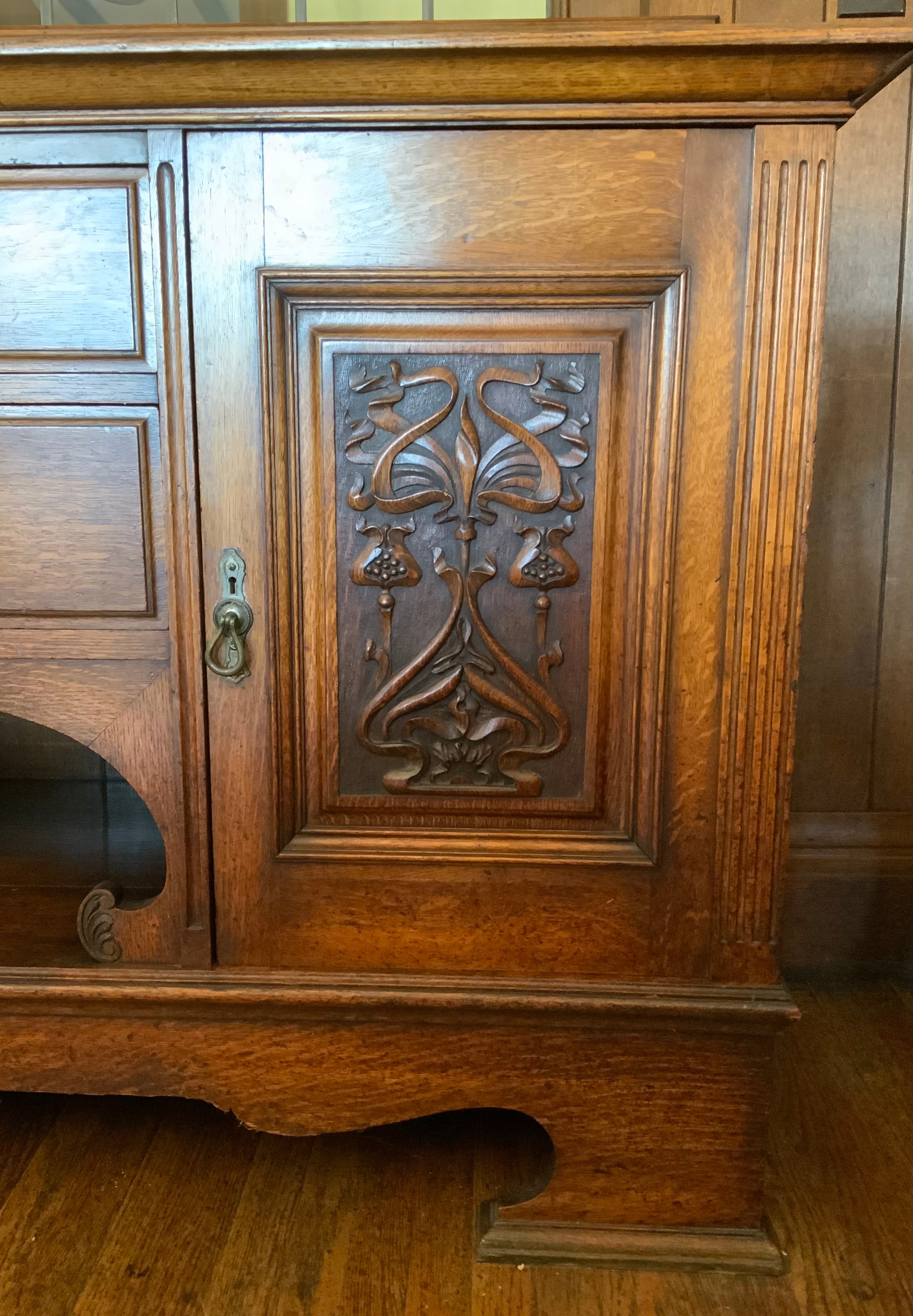 An Edwardian oak sideboard, fitted with two drawers, and two panelled doors, carved with scrolls, - Image 3 of 4