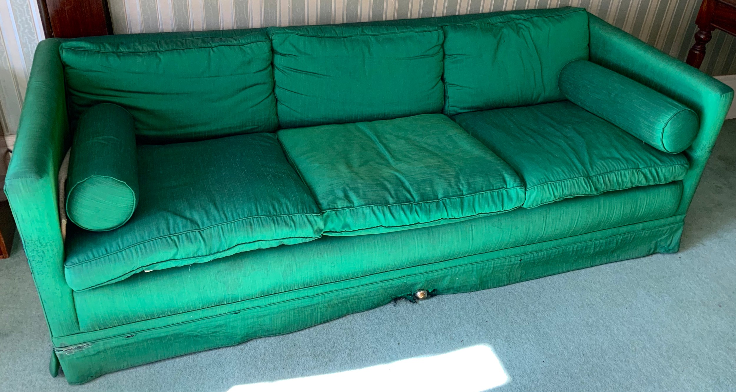 An early 20th century sofa, upholstered green silk, 89cm deep, 217cm wide; two similar side