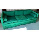 An early 20th century sofa, upholstered green silk, 89cm deep, 217cm wide; two similar side