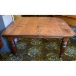 A late Victorian mahogany canted rectangular wind-out dining table, fluted legs, 79cm high, 125cm