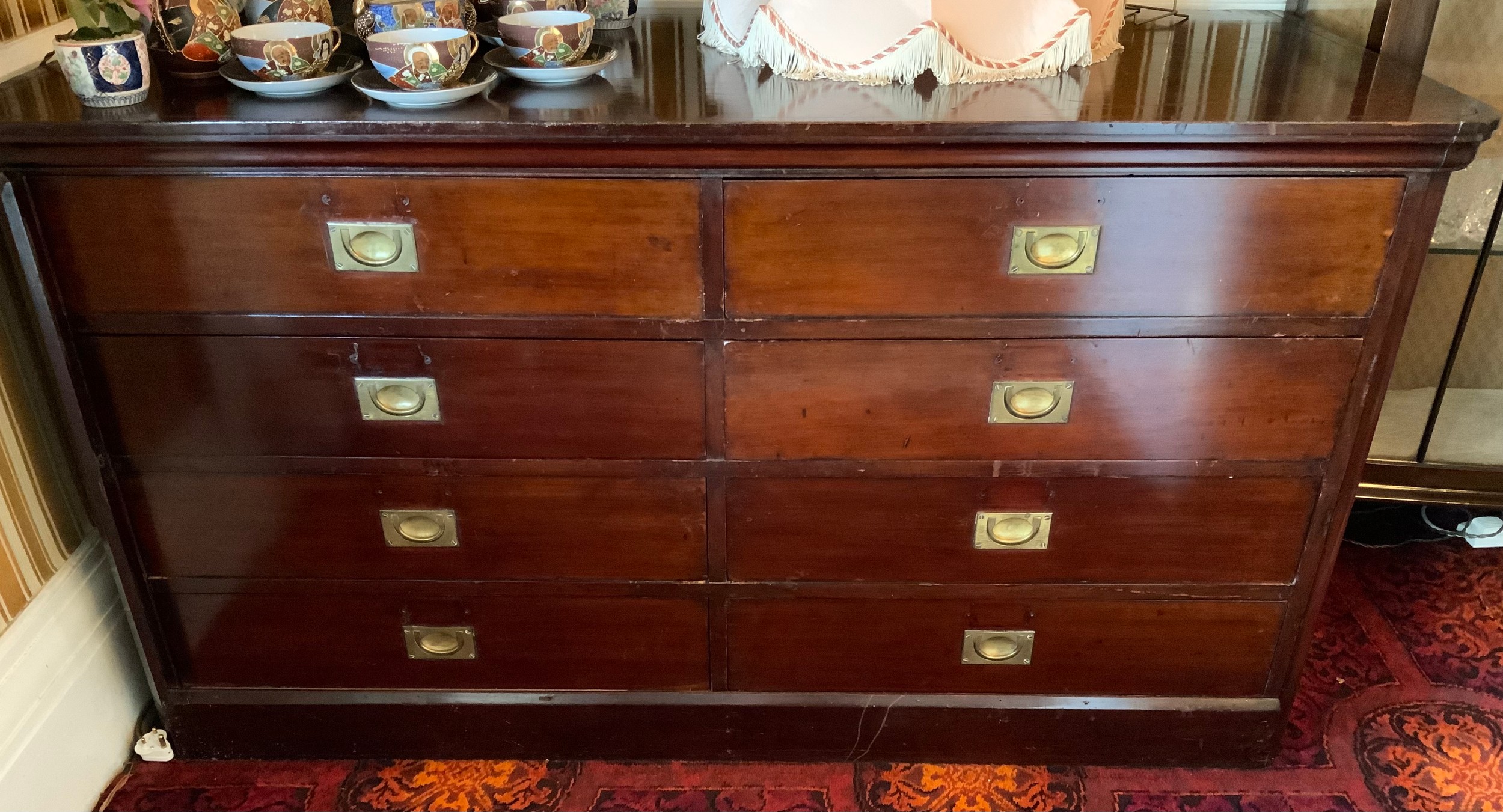 A 19th century mahogany chest, rounded rectangular top, two rows of four drawers, one side with