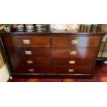 A 19th century mahogany chest, rounded rectangular top, two rows of four drawers, one side with