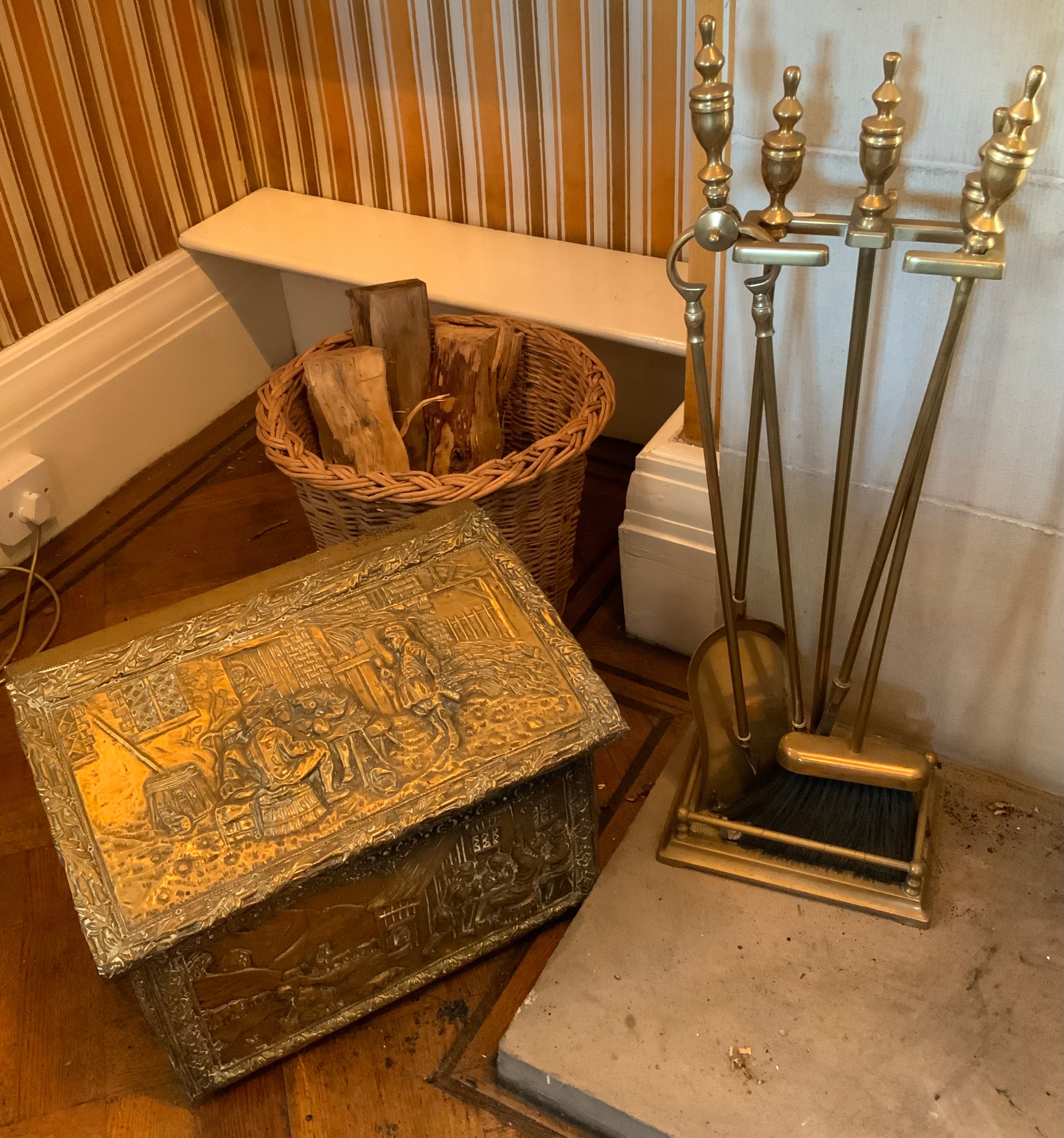 A set of five brass fire side implements and stand, the stand 61cm high; a embossed brass coal