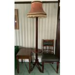 A mahogany standard lamp, with shelf, four sabre legs; a mahogany side table; a Victorian mahogany