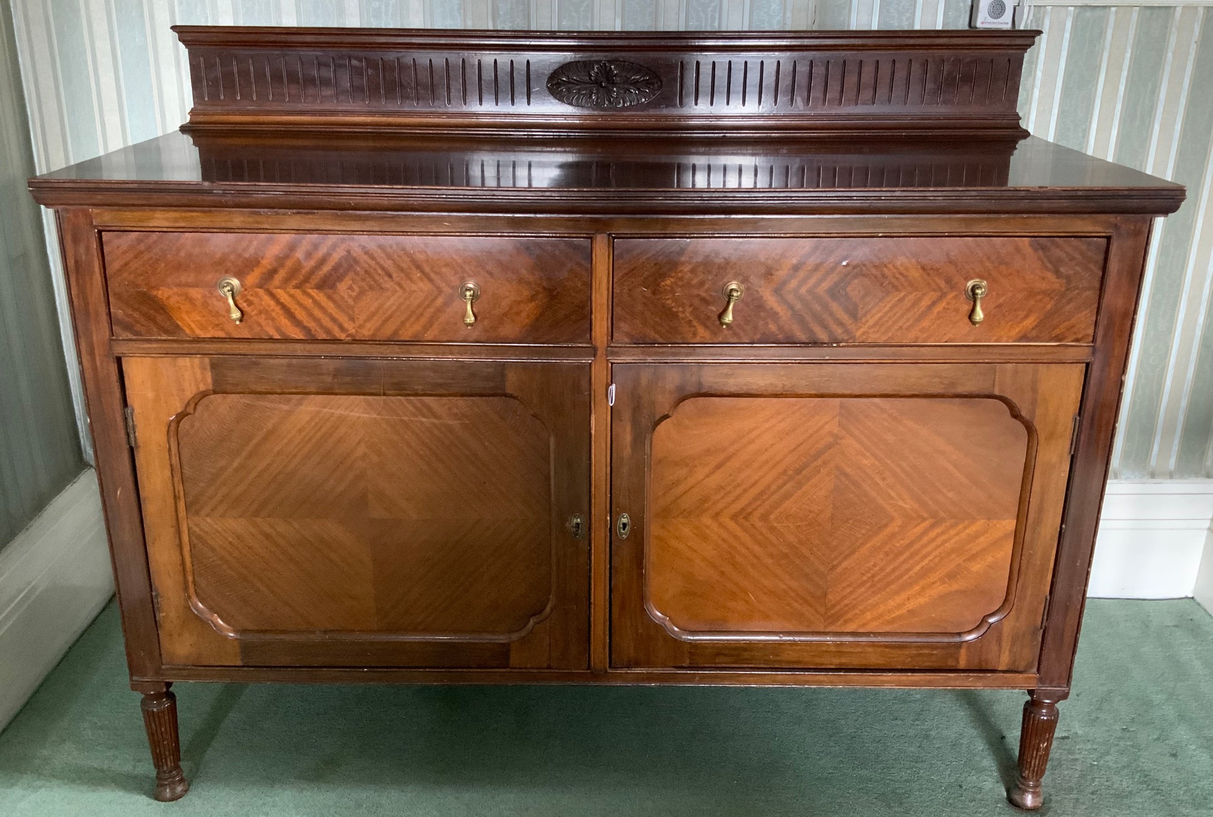 An early 20th century mahogany sideboard, fluted back gallery, two drawers above tow fielded - Image 2 of 4