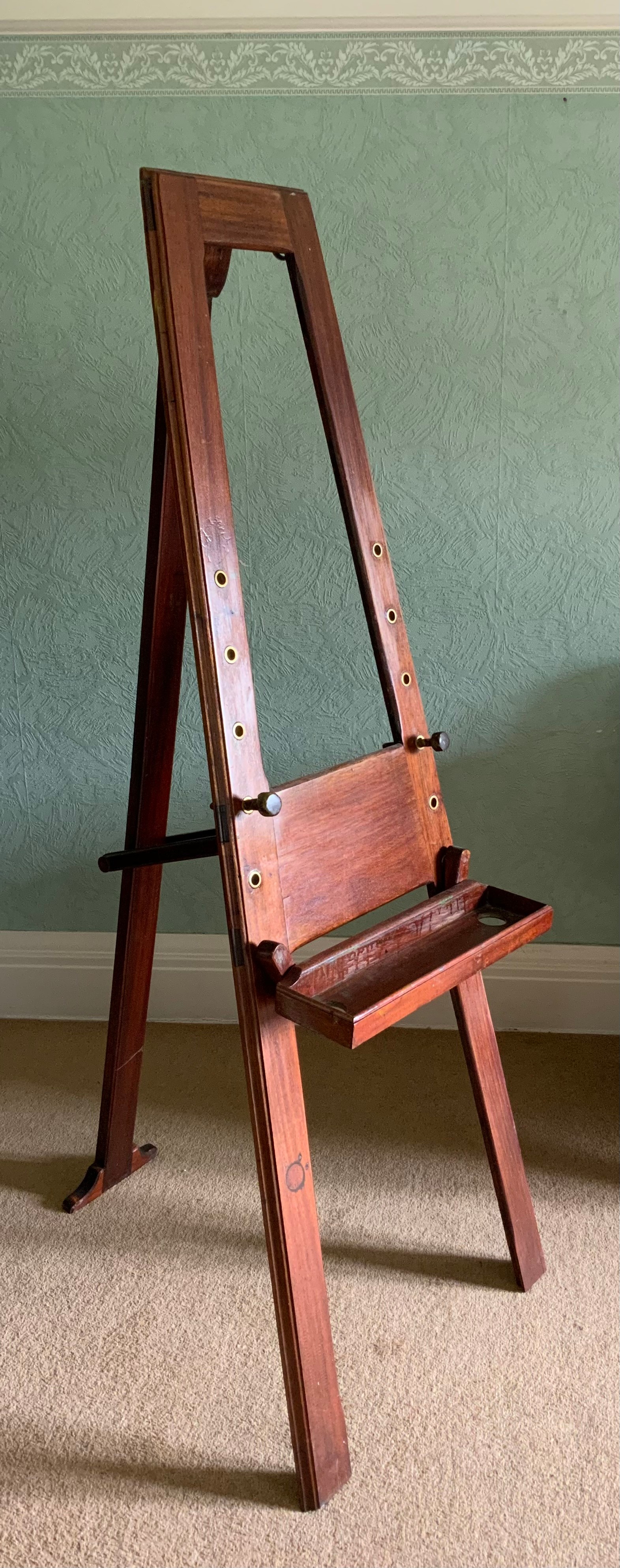 A mahogany artist's easel, 174cm high ** We would please ask that all payments are made by 12pm on