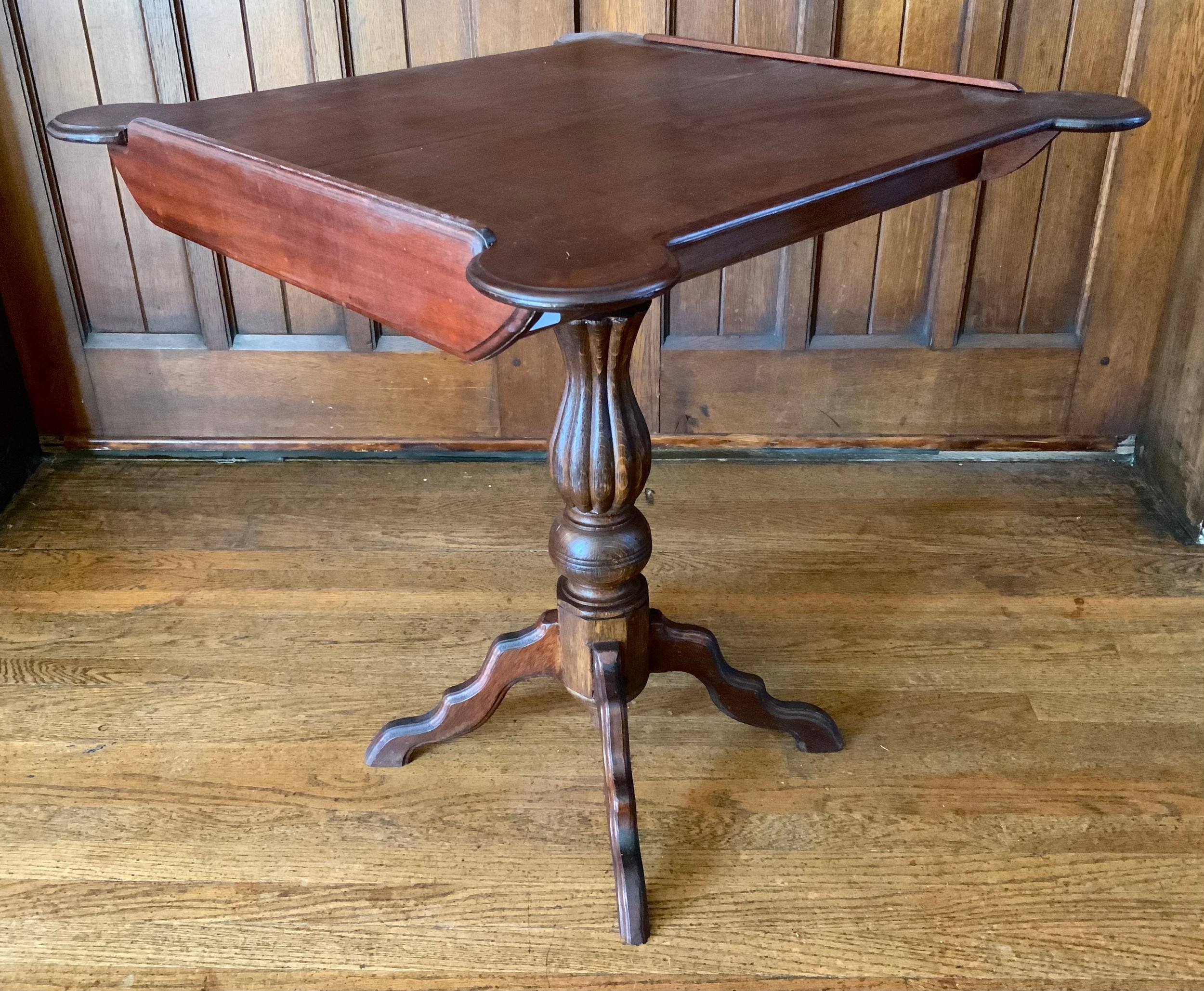 A 19th century mahogany side table, shaped top, associated fluted baluster column, four shaped legs,