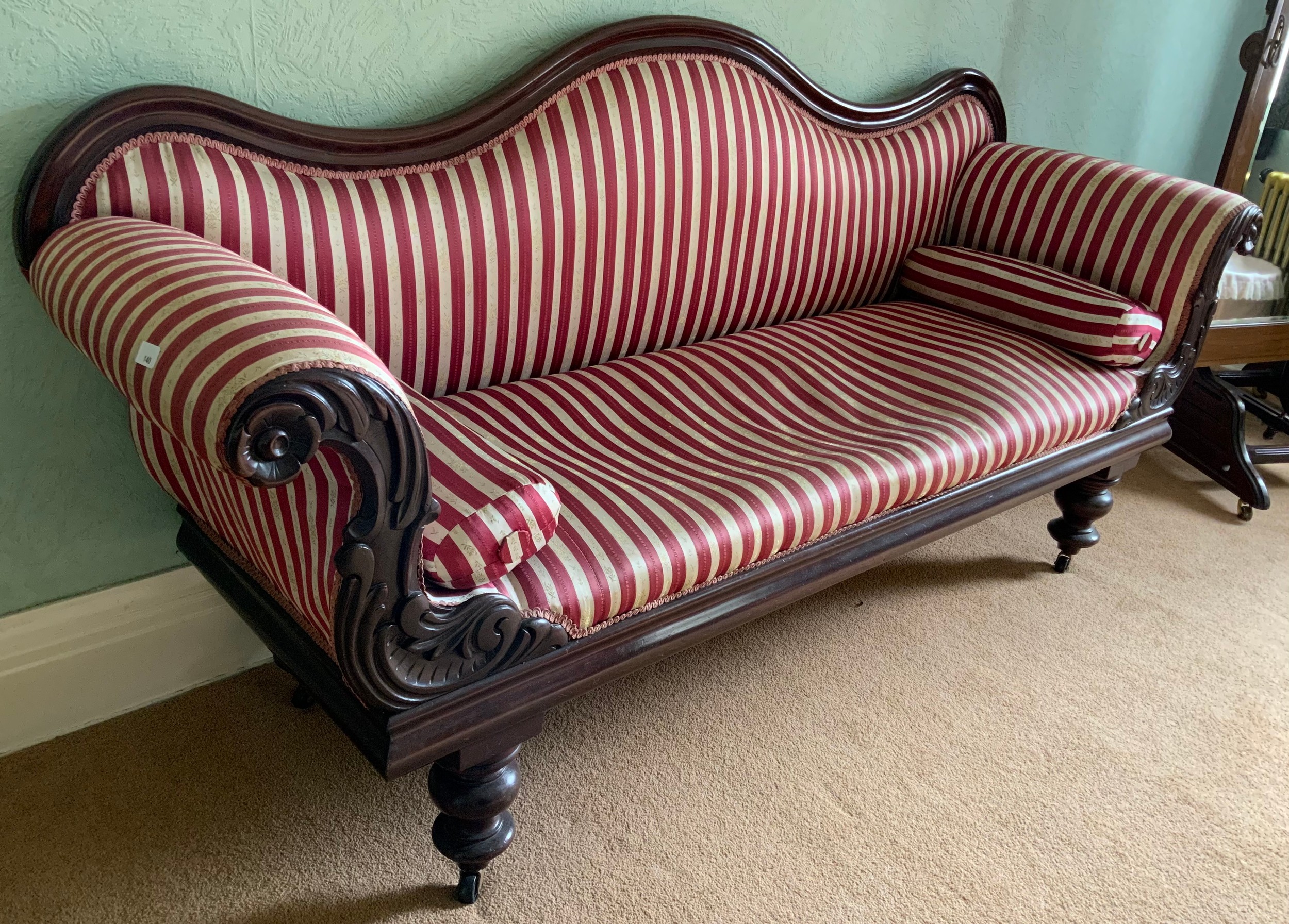 A Victorian mahogany sofa, leafy scroll arms, turned legs, red adn white striped upholstery, 208cm - Image 3 of 3