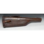 Shooting - an early 20th century brown leather shoulder of mutton gun case, printed label Holy