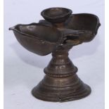 An Indian bronze lamp, lotus trumpet base, 8cm high, 19th century
