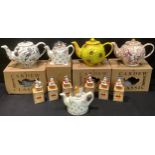 A Cardew Design prototype teapot, Alice in Wonderland, dated'98, boxed; other Cardew teapots,