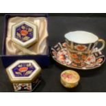 A Royal Crown Derby 1298 pattern hexagonal trinket box, boxed; another; a 2451 pattern tea cup and