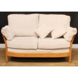 An Ercol elm Renaissance sofa, design 24112, fabric E631, 104cm high, the seat 141cm wide and 57cm