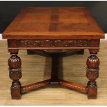 A Jacobean style oak draw-leaf refectory dining table, rectangular top with two retractable leaves