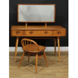 An Ercol elm and beech dressing table, 123.5cm high, 114.5cm wide, 48.5cm deep; a conforming low