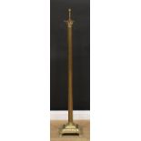 A brass floor standing lamp, Corinthian column, stepped square base, paw feet, 139cm high overall