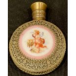 A filigree and ruby glass scent bottle, central porcelain plaque decorated with cherub, 7cm long