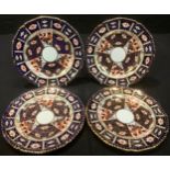 A set of four Royal Crown Derby 2451 Traditional Imari pattern shaped circular plates, 22cm