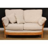 An Ercol elm Renaissance sofa, design 24112, fabric E631, 104cm high, the seat 141cm wide and 57cm
