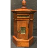 A 20th century mahogany table top correspondence box, modelled as a Victorian letter box, 47cm high