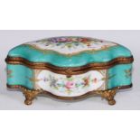 A Continental gilt metal mounted porcelain shaped serpentine casket, decorated with reserves of