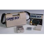 Retro Gaming - a Nintendo Game Boy Model No. DMG-01 with portable carry-all DLX case; Nuby game