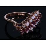A 9ct gold ring, set with three bands of polished opal and faceted ruby stones, size L, marked 375,