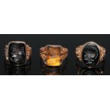 A gentleman's seal ring, the curved rectangular tigers eye tablet engraved with a intaglio after the
