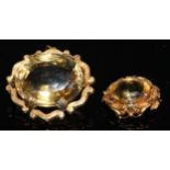 A Victorian pale yellow citrine brooch, unmarked yellow metal mount, another smaller 20.8g gross (2)