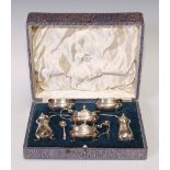 A George VI silver six piece condiment set, the peppers 8cm high, Chester 1939, 226g, cased