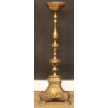 A brass floor-standing candle stand or statuary pedestal, 102cm high, the top 19cm wide