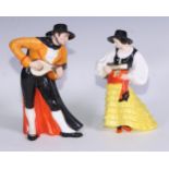 A Royal Crown Derby figure, Spanish Duet, he stands wearing a black hat and and long cape, holding a